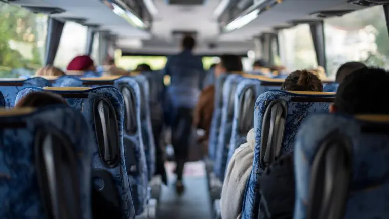 Passengers seated on a motorcoach during a group tour